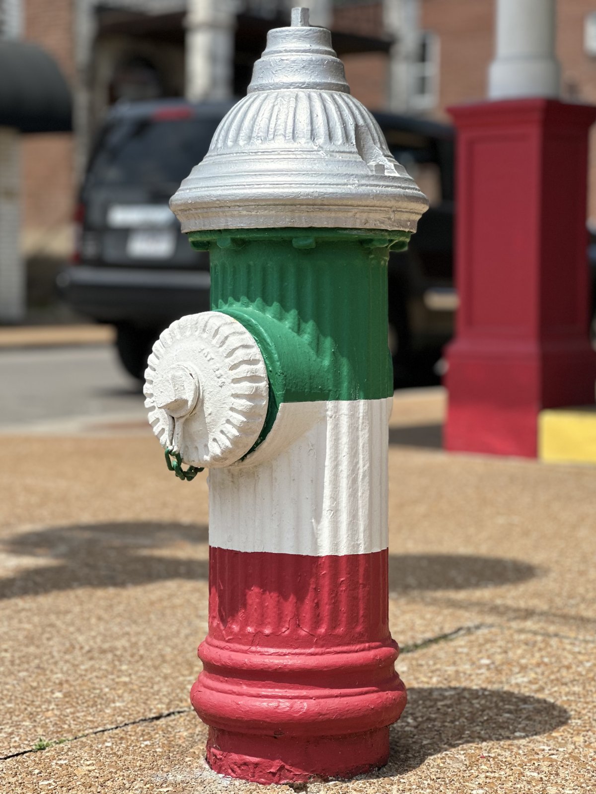 A fire hydrant painted in Italian flag colors on The Hill, St. Louis